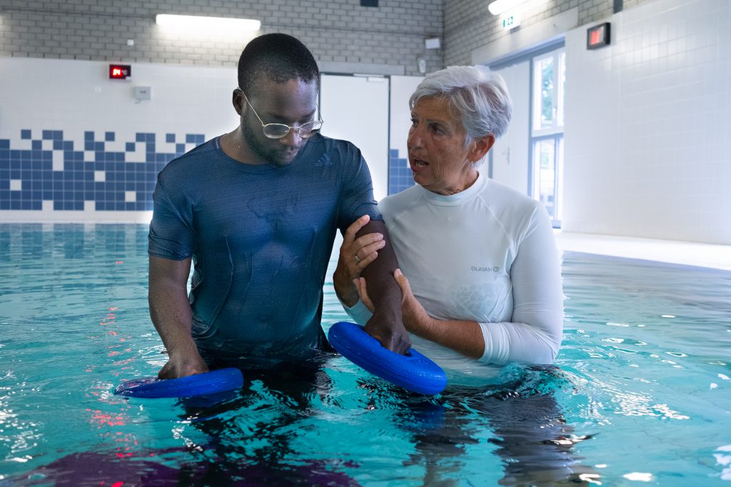 Therapist and patient in Aquatic Therapy session