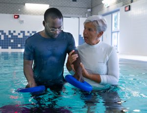 Therapist and patient in Aquatic Therapy session